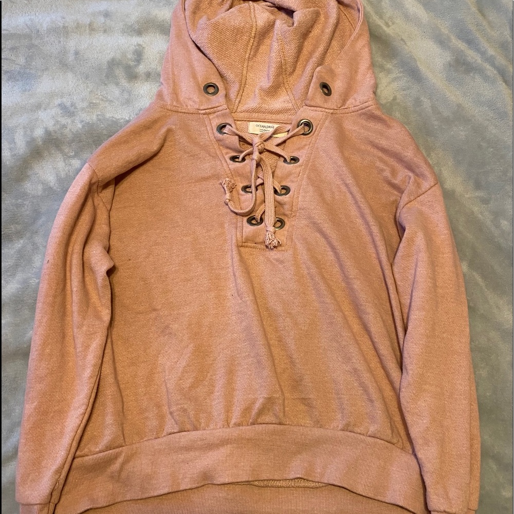 A pink colored sweater